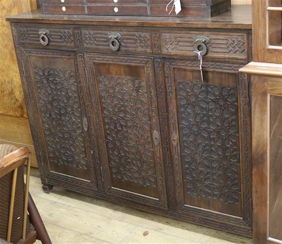 A carved oak sideboard, Art and Crafts style W.147.5cm